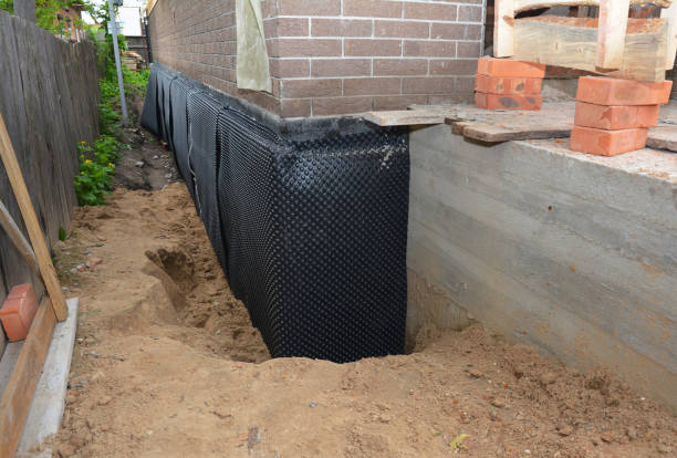 SJ Waterproofing Pros technician performing targeted Waterproofing assessment in Raymond, WA